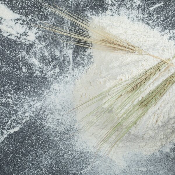 flour-with-ears-wheat-marble-surface_114579-77210